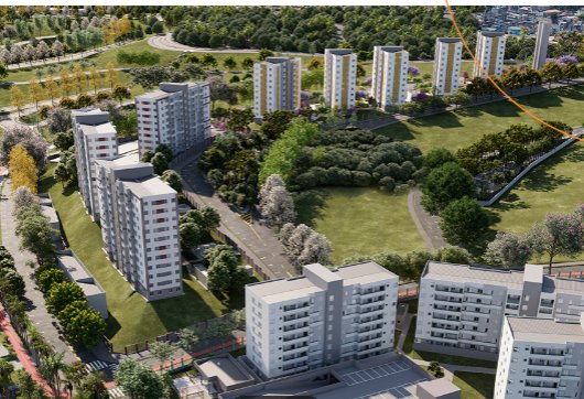 Vista aérea de torres residenciais cercadas por áreas verdes